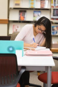 Student studying in the learning commons